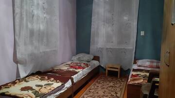 Фото номера Просторный двухместный номер с 2 отдельными кроватями Гостевой дом Гостевой дом у моря г. Алахадзы 6